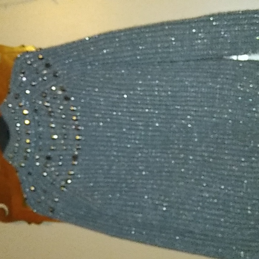 Grey sweater with silver stone patteren at top